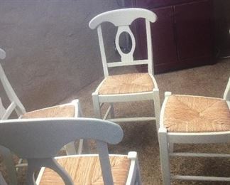 Set of 4 white and wicker chairs. Excellent condition. Great price. 