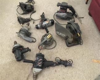Assortment of hand drills and sanders