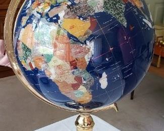 Blue lapiz world globe with semi-precious inlaid stone.         36" circumference, 24" tall