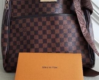 NEW,(never used), Louis Vuitton backpack bag with original receipt and paperwork