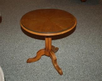 Small round glass topped pedestal table, 18 " W x 18" H
