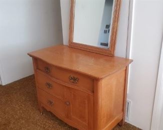 #226.  $250.00  Vanity/Commode. Includes the mirror.  Sold oak.  28"h x 36"w x 20" deep. Appx measurements. 
