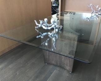 Gorgeous glass top with beveled edges sitting on two wooden sculptures  measurements 48 x 96inches 29 inches tall.  $1100 pristine 