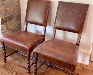 pair of leather side chairs with turned legs by Stanley
