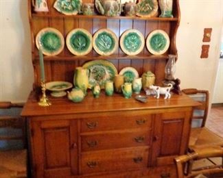 Solid cherry Stickley colonial style hutch from the 1950's and a great collection of choice majolica pieces.