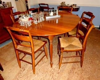 Hitchcock cherry dining table and eight Hitchcock chairs.