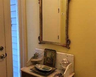 Beautiful mirror over antique marble topped washstand.