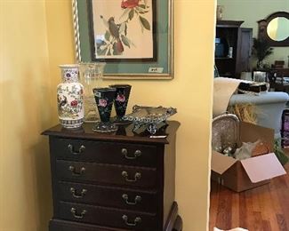 Silver chest with framed art work.