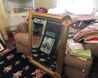 Beautiful shell mirror with sofa and some of the beautiful linens.