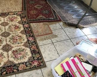 Quite a number of oriental rugs and needlepoint ones