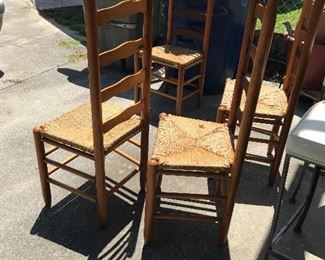 Four ladder back chairs