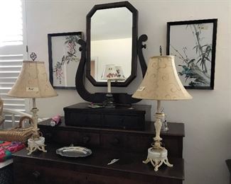Very nice shaving mirror with drawers. Antique chest with lots of drawers. Pretty lamps.