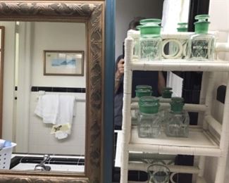 Vintage wicker shelving with vintage bathroom set. Glass with names imprinted—witch hazel, bicarbonate of soda, etc.