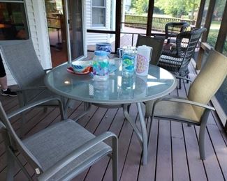 Sunbrella Patio table and chairs, always kept in screen porch. Excellent condition 