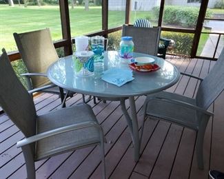 Sunbrella Patio table and chairs, always kept in screen porch. Excellent condition 