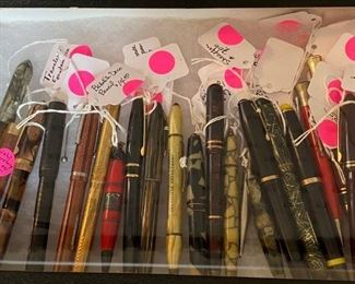 A selection of vintage pens and pencils