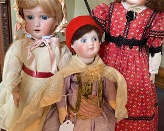 Two German bisque dolls and one French bisque.