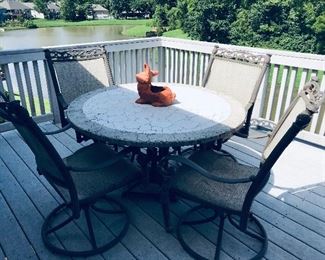 Wonderful Patio Set.  Table and 4 chairs that swivel.  Easy to move