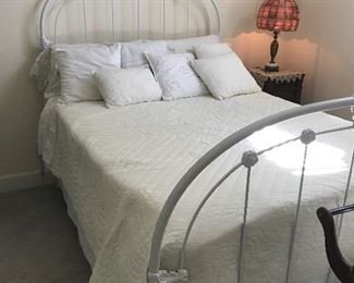 Beautiful Iron Full Size Bed.  The bedding is exquisite  with a w a w a queen size hand quilted quilt, vintage pillow sham that holds two pillows to lay on bed. Decorate pillows embroidered, tatted and candlewick patterns