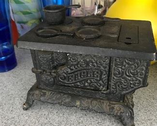 Wonderful little minature iron stove with all the accessories.