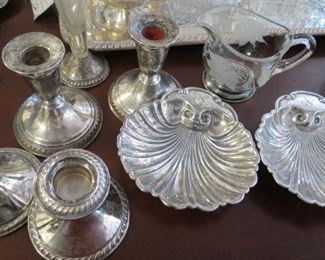 Sterling silver candlesticks and  nut dishes.