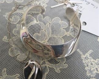 Tiffany & Co., Elsa Peretti sterling silver cuff bracelet and necklace.