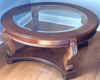 Round glass-top coffee table 
