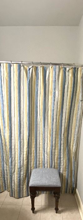 Silk stripped shower curtain and upholstered stool 
