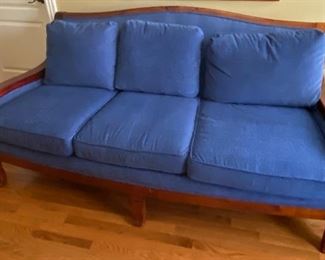 Blue settee with carved armrests 