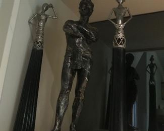 2 thai figures and an austin sculpture piece
