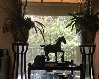 beautiful pair of fern/plant  stands with the asian vases and faux arrangements also many crystal pieces, murano great looking horse on the Michael Weiss table