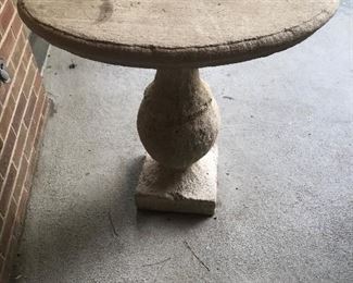 one of a pair of the concrete oval petite tables 