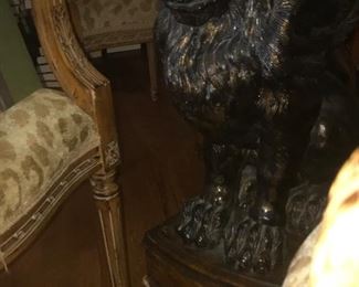 one of the lions from the pedestal dining table with glass top