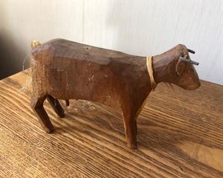 Antique hand carved wooden cow figurine