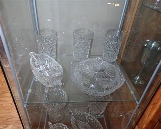4 SIDED GLASS DISPLAY CASE MULTI SHELVES  AND A VERY LARGE SELECTION OF STEMWARE
