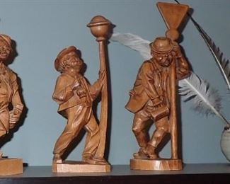 WOOD CARVED MEN BY LAMPSPOST