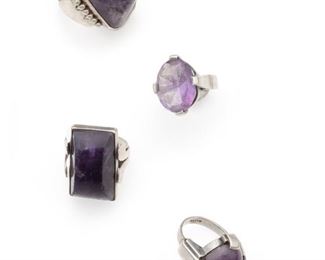 1019
A Group Of Fred Davis Silver And Amethyst Rings
Pre-1948; Mexico City, Mexico
Stamped: FD for Fred Davis; Further stamped: Silver / Made in Mexico / LVED
Comprising a faceted oval amethyst ring (6), an oval cabochon ring (7), a rectangular cabochon with I-shape (7), and a rectangular cabochon ring with half-sphere design (10.25), 4 pieces
47.0 grams
Estimate: $800 - $1,200