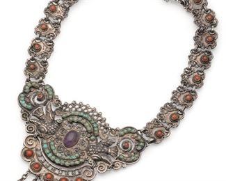 1044
A Matl Gem-Set Necklace
1934-1948; Taxco, Mexico
Signed: Matl
Designed by Matilde Poulat, the elaborate dove-motif centerpiece with coral, amethyst, and turquoise fringe
15.5" L x 3.325" H x 4" W
84.0 grams
Estimate: $2,000 - $3,000