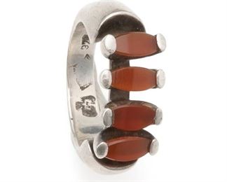 1072
An Antonio Pineda Silver And Carnelian Ring
1953-1979; Taxco, Mexico
Crown mark for Antonio Pineda; Eagle 17; Further stamped: 970
The modernist-style ring set with four oval-shaped carnelian
Ring size: 8.25
12.9 grams
Estimate: $300 - $500