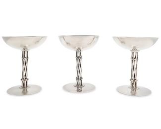 1080
Three William Spratling Sterling Silver Champagne Goblets
1956-1962; Third Design Period; Taxco, Mexico
Each stamped for William Spratling; Further stamped Eagle 30
Each goblet with a twisted spiral wire stem and silver bead decoration, 3 pieces
Each: 5.875" H x 4.5" Dia.
26.210 oz troy approximately
Estimate: $1,000 - $1,500
