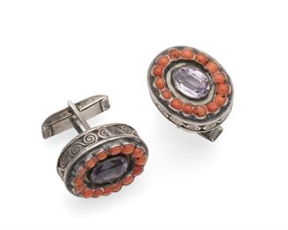 1086
A Pair Of Matl Gem-Set Cufflinks
1934-1948; Taxco, Mexico
Each stamped: Matl / 925
Designed by Matilde Poulat, each centering a faceted amethyst surrounded by coral set into a scrolled backing
.875" H x .75" W x 1" D
19.0 grams
Estimate: $500 - $700
