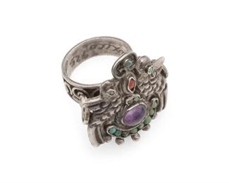 1087
A Matl Silver And Gem-Set Dove Ring
1934-1948; Taxco, Mexico
Etched: Mexico, 925, Matl
Designed by Matilde Poulat, the two doves set with turquoise eyes in a coral, turquoise, and amethyst frame with a scrolled ring shank
Ring size: 10.75; Panel: 1.325" H x 1.25" W
19.0 grams
Estimate: $600 - $800