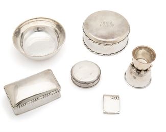 1099
Six Hector Aguilar Sterling Silver Vanity Items
1940-1945; Taxco, Mexico
Each stamped for Hector Aguilar and sterling; Various further stamps: Taxco / 940 / Made in Mexico / Sterling
Comprising one large and one small round vanity box, a rectangular vanity box, a silver matchbook, a round dish, and a studded double-sided chalice, two items personalized, 6 pieces
Largest box: 2.25" H x 5.375" Dia.
46.340 oz. troy approximately
Estimate: $600 - $800