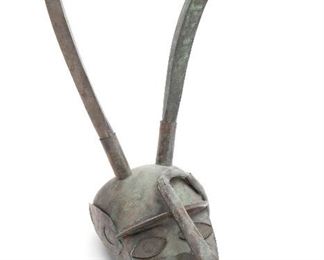 1118
A Peruvian Mixed-Metal Mask
Mid-20th Century; Peru
Apparently unmarked (possibly Graziella Laffi)
The abstract mask with long curved horns and tusks
21" H x 25" W x 15" D
Estimate: $800 - $1,200