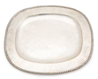 1130
A William Spratling Serving Tray
1940-1944; First design period; Taxco, Mexico
Stamped for William Spratling [WS Print Circle] and Sterling: Spratling Silver
The large heavy rectangular tray with rope edge
.75" H x 14.5" W x 13" D
38.925 oz. troy approximately
Estimate: $700 - $900