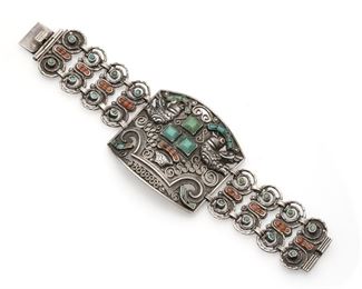 1150
A Matl Sterling Silver And Gem-Set Bracelet
Third-quarter 20th Century; Taxco, Mexico
Stamped: Matl / Salas / Mexico / 925
Designed by Ricardo Salas, the double bird panel with coral and turquoise flanked by scrolled gem-set links
7.25" L x 2" H
73.0 grams
Estimate: $800 - $1,200