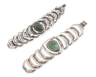 1156
Two Matl Gem-Set And Silver Bracelets
1934-1940; Taxco, Mexico
Stamped: Matl; One stamped: 0.900
Each designed by Matilde Poulat, comprising a bracelet centering a carved green stone mask set into a hollow scrolled frame flanked by stylized half-moon links (6.75" L x 1.5" H), together with a bracelet centering a carved pre-Columbian mask in a handmade frame with stylized crescent moon-shaped links (7" H x 1.75" H), 2 pieces
130.5 grams
Estimate: $700 - $900