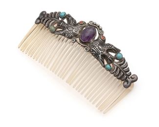 1158
A Matl Silver And Gem-Set Hair Comb
1934-1940; Taxco, Mexico
Stamped: Matl
Designed by Matilde Poulat, the repousse lovebirds flanking an amethyst cabochon and further set with natural and faux turquoise cabochons
2.25" H x 4.125" W
32.5 grams gross
Estimate: $400 - $600