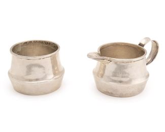 1161
A William Spratling Sterling Silver Cream And Sugar Set
1956-1962; Third Design Period; Taxco, Mexico
Each stamped for William Spratling; Further stamped for sterling: [Eagle 30]
The simple circular cream jug with slightly elongated and flattened spout, both with bulbous bases, 2 pieces
Cream jug: 2.125" H x 4.125" W x 2.75" D; Sugar: 2" H x 2.75" Dia.
6.105 oz. troy approximately
Estimate: $300 - $500