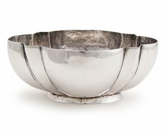 1162
A William Spratling Sterling Silver Bowl
1931-1946; First Design Period; Taxco, Mexico
Stamped for William Spratling; Further stamped: Spratling Silver
The scalloped bowl with hand-hammering
2.375" H x 6" W x 5" D
8.6 oz. troy approximately
Estimate: $400 - $600